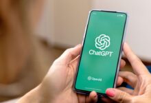 Man holding amobile that showing chatgpt app
