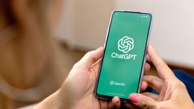 Man holding amobile that showing chatgpt app